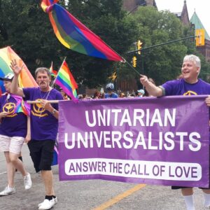 group at pride with unitarian universalist banner