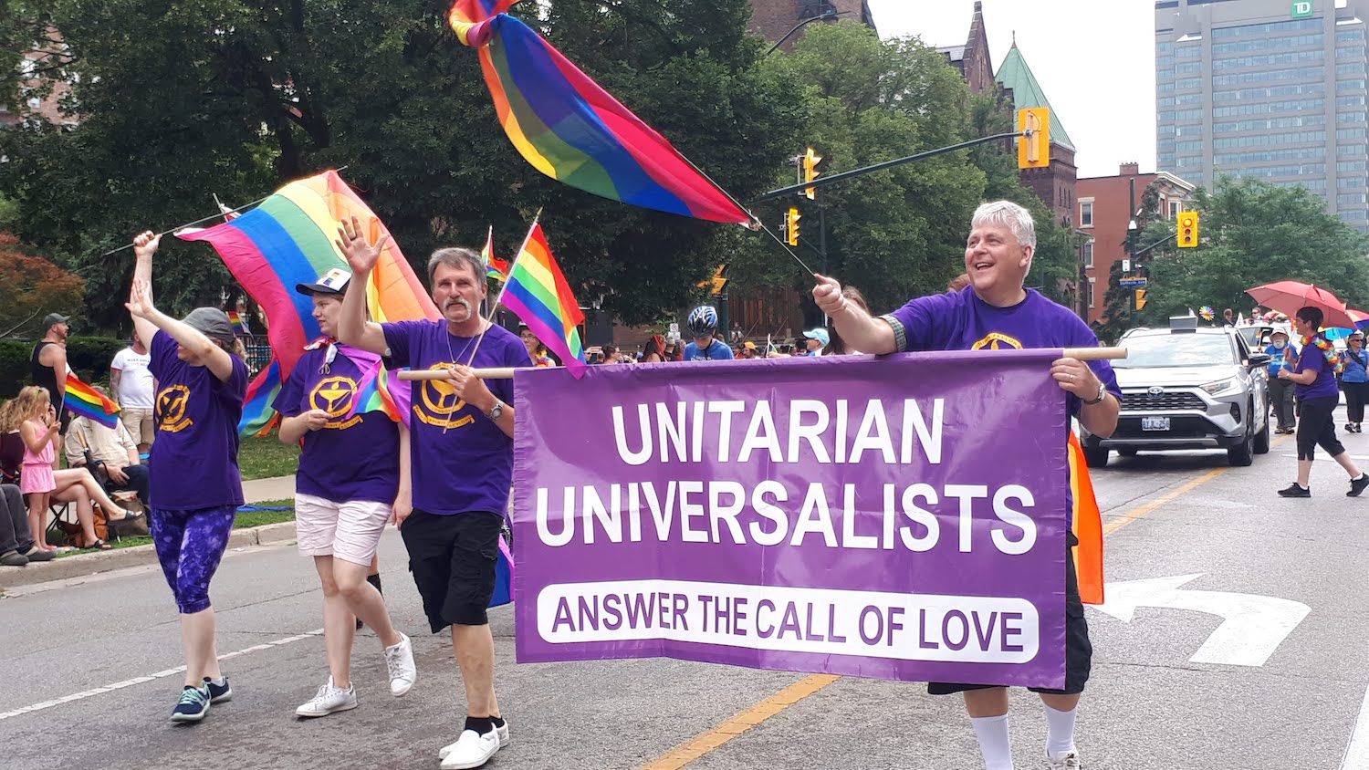 group at pride with unitarian universalist banner