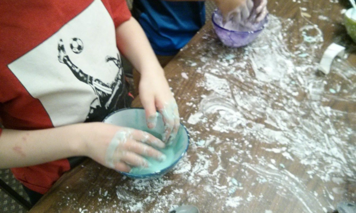 Kids making slime (just hands)